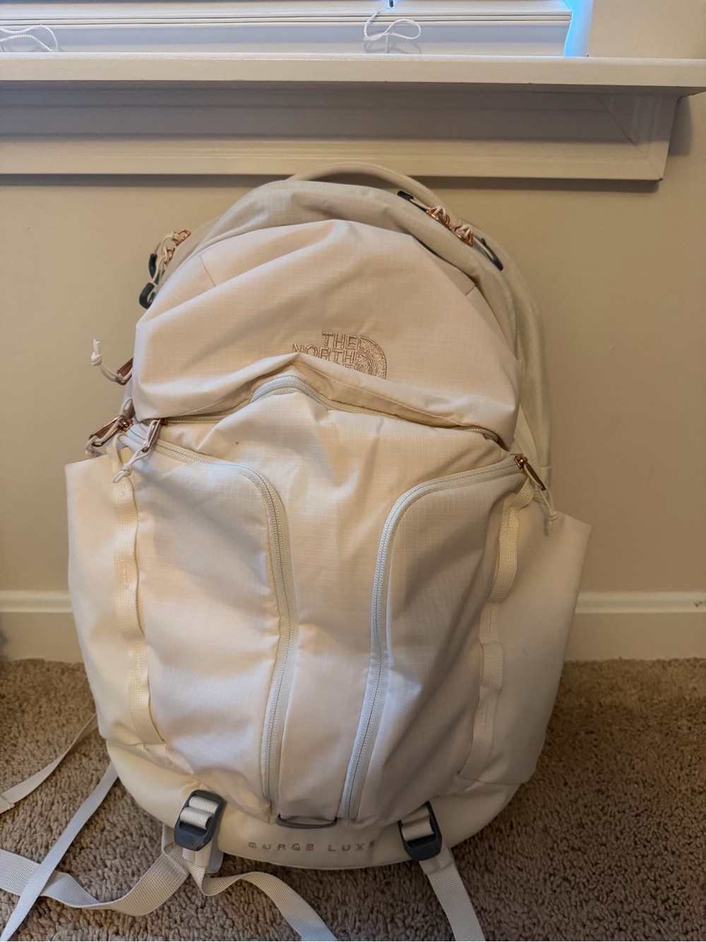 The North Face Surge Lux Backpack in Cream with Rose Gold(good as new 90%)